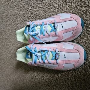 Nike Pink and White Sneakers with Streamlined Design